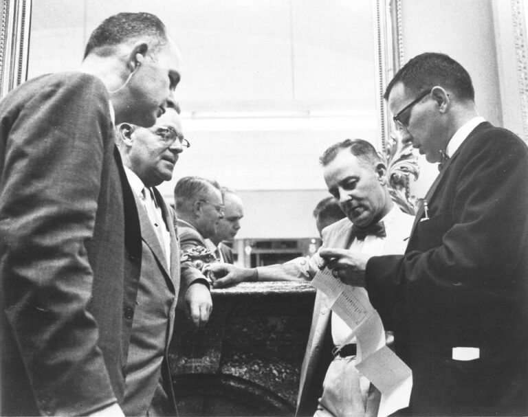 Ted Stevens, right, shows (L-R) C.W. Snedden, NY Congressman Leo O'Brien, and George Lehleitner a senate vote tally sheet on June 30, 1958 after Alaska was voted in as the 49th state. Stevens Foundation photo