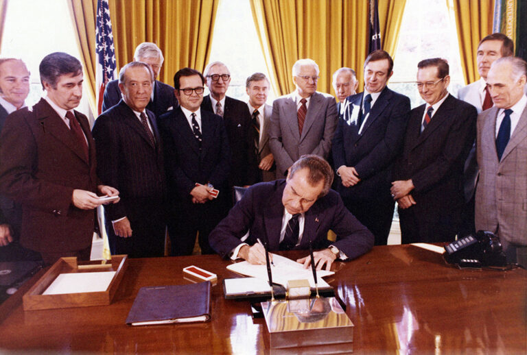 President Richard Nixon signed the Trans-Alaska Pipeline Authorization Act (TAPS) on November 16, 1973. At left front is Sen. Mike Gravel, Sen. Henry 