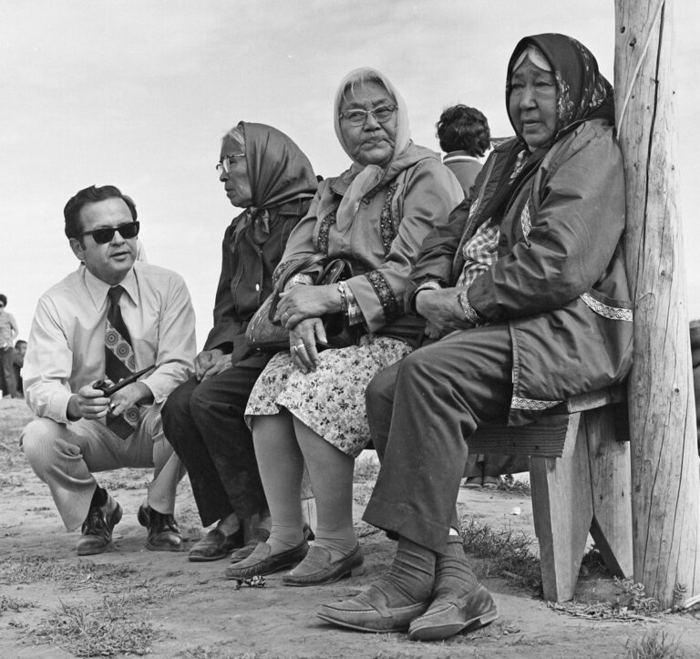 Senator Ted Stevens visits Tanana on June 16, 1973 and talks with, l-r, Gladys John and Nettie Erhart of Tanana, and Agnes Jimmie of Galena. There were games and races for youhgsters in the village that day. Mike Dalton/Stevens Foundation photo