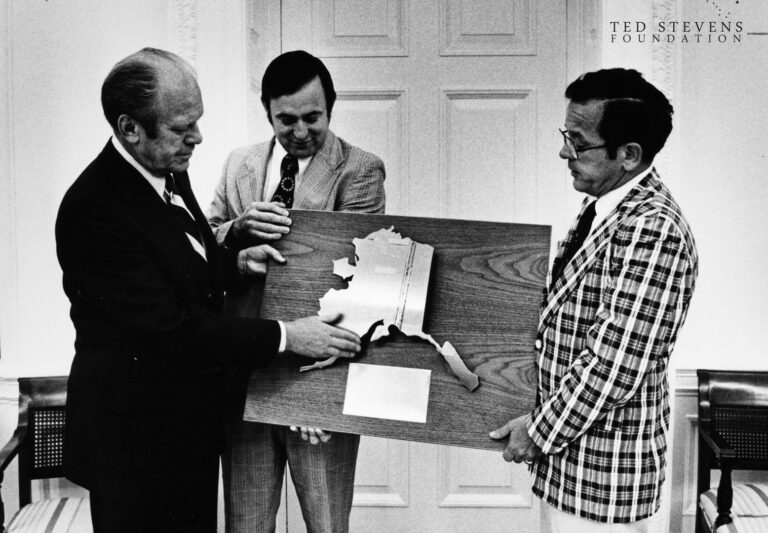 Senator Ted Stevens, right, and Rep. Don Young, center, present to President Gerald Ford a plaque featuring a map of Alaska made of pipe metal etched with the pipeline route on July 17, 1975 in the White House. (White House/Stevens Foundation photo)