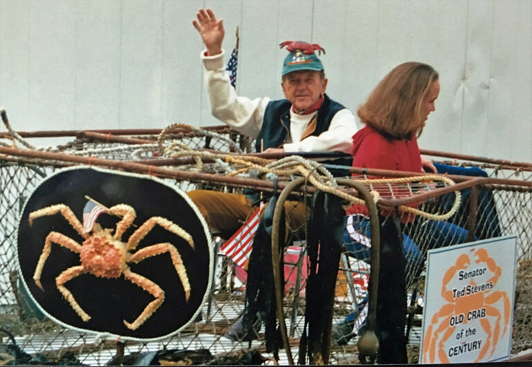 Senator Ted Stevens accompanied by daughter Lily rides a float during the 2000 4th of July parade in Seldovia. Stevens was named the 