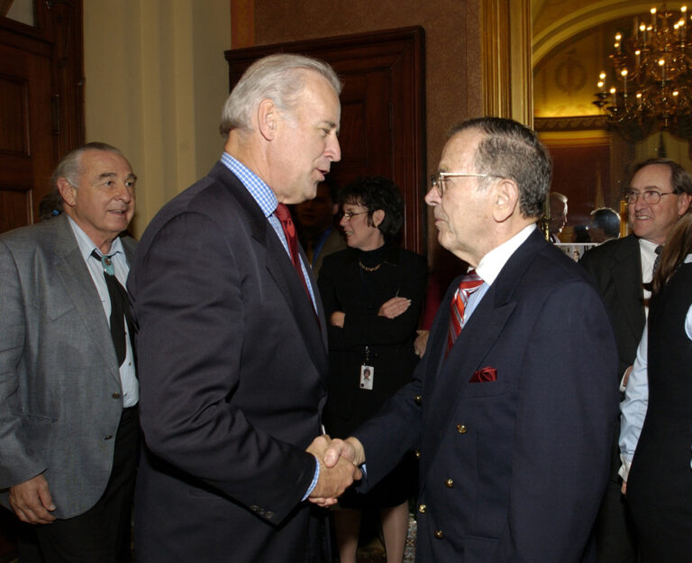 Sen. Joe Biden congratulates Sen. Ted Stevens at Stevens' 80th birthday celebration on November 18, 2003 in the Strom Thurmond Room of the Capitol. Sen. Ben Nighthorse Campbell is at left. (U.S. Senate/Stevens Foundation photo)