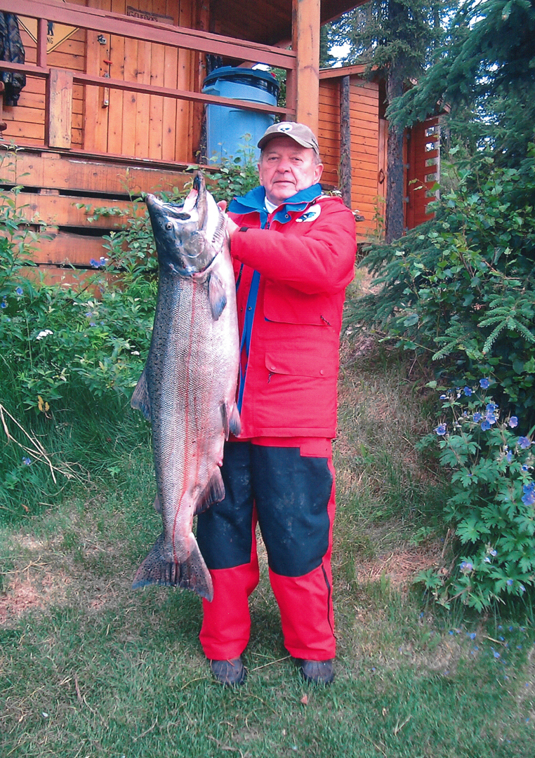 Sen. Ted Stevens with a king salmon he hauled in during the July 2004 Kenai Classic. Stevens Foundation photo