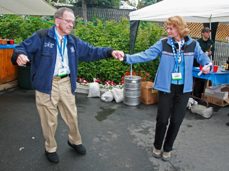 Senator Ted Stevens and Senator Lisa Murkowski share an impromptu dance at the Kenai River Classic in July of 2007. Photo courtesy Kenai River Sportfishing Association/Fitzgerald Photography.