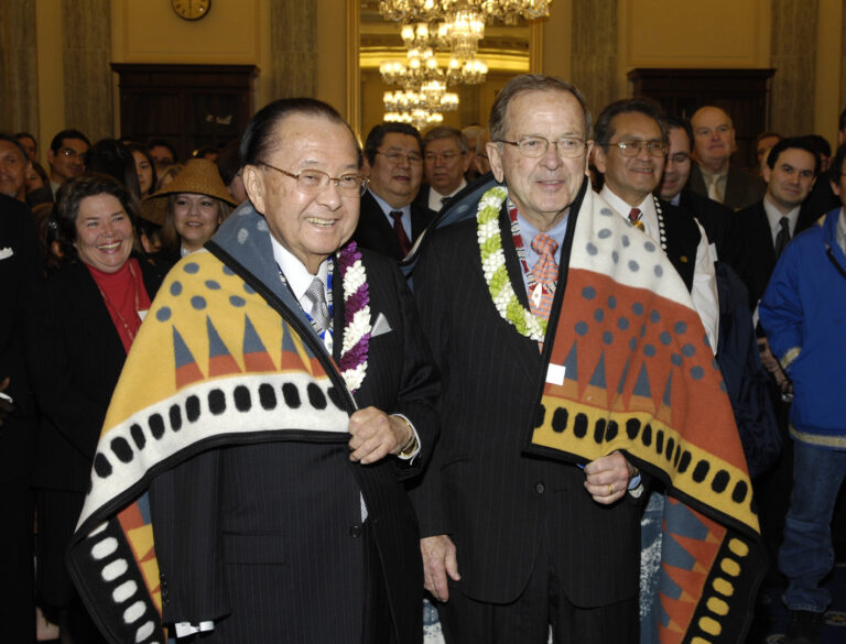 Senator Daniel Inouye (D-HI), left, and Senator Ted Stevens are greeted at a reception held by the Alaska Federation of Natives (AFN) in their honor on February 28, 2007 in Washington D.C. During the program, both would receive names from the Arctic Slope, Bering Straits/Kawerak, Calista, Chugach, Doyon, Nana, and Sealaska Native Corporations. Stevens Foundation photo.