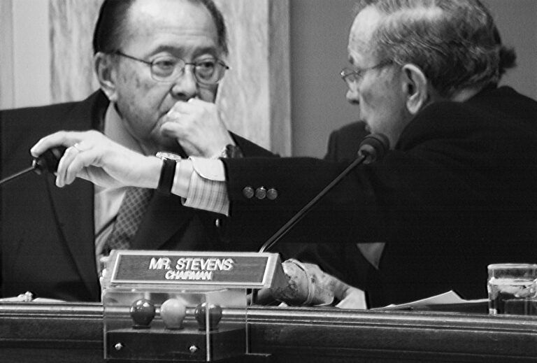 Sen. Daniel Inouye (D-HI), left, and Se. Ted Stevens confer during a committee meeting. Unknown committee and unknown date. (Possibly 2005?) Stevens Foundation photo